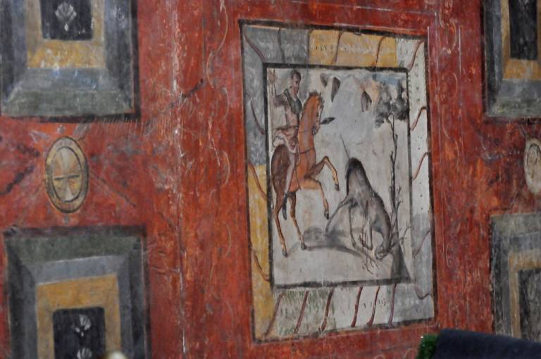 Mérida, pintura mural enmarcada en una casa romana, como si se tratara de un cuadro